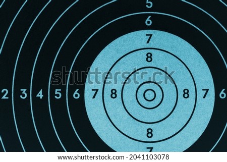 Target for shooting. Dark black and blue inverted background or wallpaper. Backdrop for shooting sports and training
