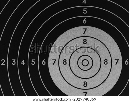 Target for shooting. Dark black and gray inverted background or wallpaper. Backdrop for shooting sports and training