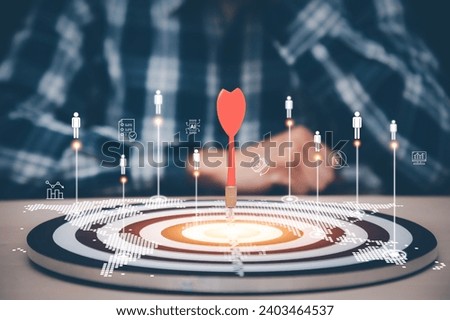 Targeting the business concept, Businessman hand holding red dart to the virtual target dartboard, Executive marketing, investment goal and target for business investment concept, 