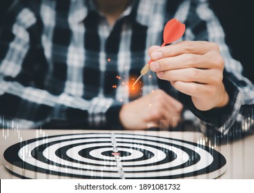 Targeting the business concept, Businessman throwing red arrow dart to virtual target dart board,Executive marketing, investment goal and target for business investment concept.