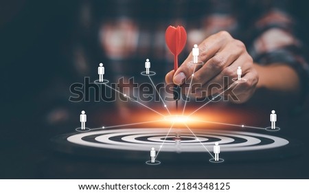 Targeting the business concept, Businessman touch red arrow dart to the virtual target dartboard, Executive marketing, investment goal and target for business investment concept, mini home.