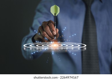 Targeting the business concept, Dart is an opportunity and Dartboard is the target and goal. So both of that represent a challenge in business marketing as concept. - Shutterstock ID 2264974167