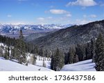 Targhee Pass in Caribou - Targhee National Forest with Snow covered Blue Mountains and Pine Trees