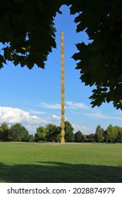 Targu Jiu, RO - August 11, 2021: Column of Infinity (Coloana Infinitului) from the Sculptural Ensemble of Constantin Brancusi. Homage to Romanian soldiers of WW1. Original summer view of monument site