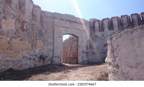 Tarifa, Spain. 08.21.2016 - Old abandoned military base on the Isla de las Palomas in Tarifa (Cádiz). There are remains of buildings and defensive constructions of war. It is a sunny day in Andalusia.