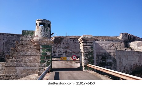 Tarifa, Spain. 08.21.2016 - Old abandoned military base on the Isla de las Palomas in Tarifa (Cádiz). There are remains of buildings and defensive constructions of war. It is a sunny day in Andalusia.