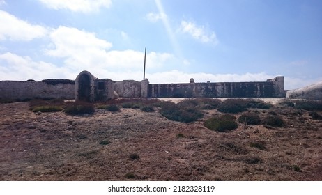 Tarifa, Spain. 08.21.2016 - Old abandoned military base on the Isla de las Palomas in Tarifa (Cádiz). There are remains of buildings and defensive constructions of war. It is a sunny day in Andalusia 