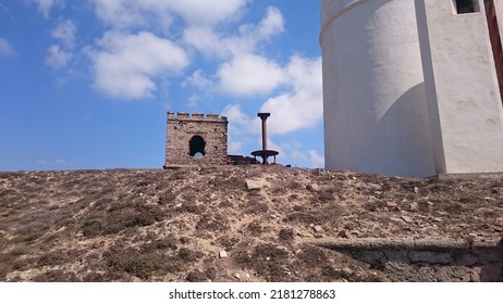 Tarifa, Spain. 08.21.2016 - White lighthouse on the Isla de las Palomas in Tarifa (Cádiz). It is the southernmost point in Europe. It is a sunny day, the sky is blue and with few clouds.