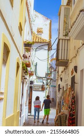 Tarifa, Spain - 4 May 2022 :couple waking in tarifa old town
