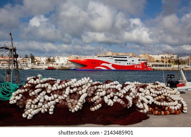Tarifa, Spain - February 6,2022: Red HSC Tarifa Jet in the Tarifa harbor. It is an 86 m fast catamaran ferry operated by Förde Reederei Seetouristik Iberia S.L.