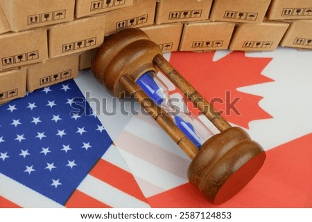 Tariffs and trading ruses changing between Canada and USA. Canadian and US flags with many carton boxes and hourglass.	