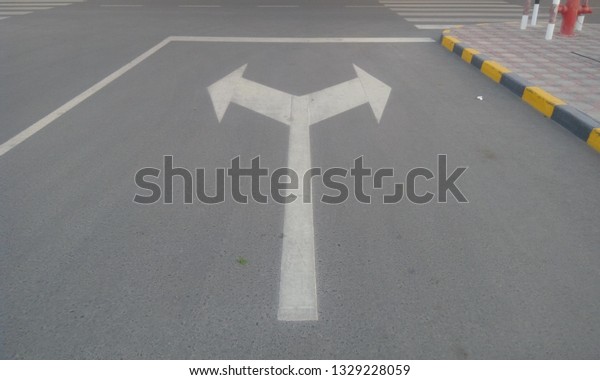 Tarmac
(asphalt) road with road signs and symbols  painted by White color
painted and posted as shutter stock
images