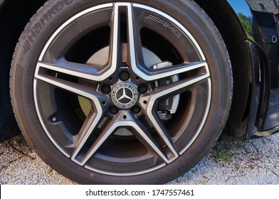 Tarn, France - May 2020 - Detail Of The Front Wheel Of A Mercedes CLA 180 AMG, A German Coupé Featuring A Tire From The Korean Manufacturer Hankook, An Aluminum Wheel Rim And A Cast Iron Brake Disk