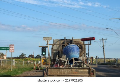 Tarneit, Vic Australia - September 4 2022: Traffic On Road In Outer Western Suburbs With Tradie Bricklaying And Concreting Equipment On Car Trailer