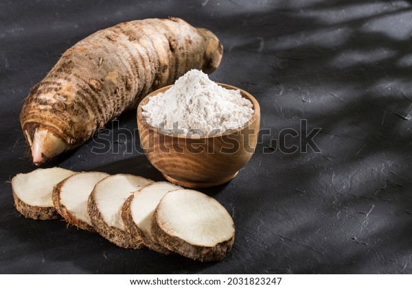 Taro Root of Colocasia esculenta and Organic Taro\
Flour in a bowl
