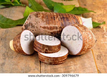 Taro root on wooden background