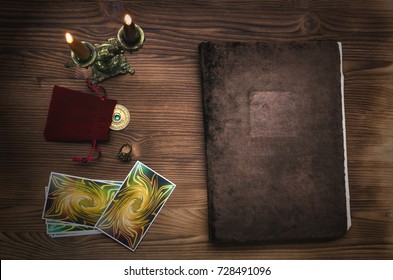 Tarot Cards. Book Of Magic On The Table.