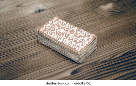 Tarot Cards Deck On Wooden Table.