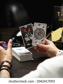 Tarot Reader Picking Tarot Cards.Tarot Cards Face Down On Table And Two Cards Are Face Up. Tarrot Reader Or Fortune Teller Reading And Forecasting Concept.