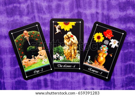 Tarot readings with deck of Tarot cards - purple cloth background