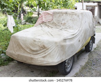 Tarp On The Old Car