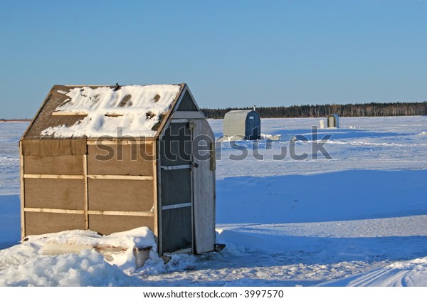 Tarpaper Ice Fishing Shack On Frozen Stock Photo Edit Now 3997570