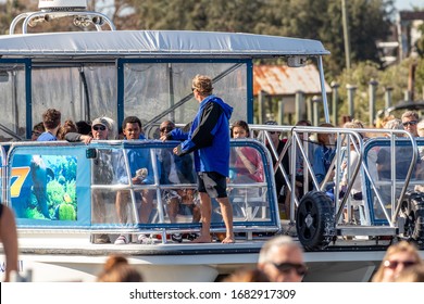 Tarpon Springs, Florida / USA - 1/18/2019:  Vacation Tourist On A Large Catamaran Pontoon Party Boat Sightseeing Birds, Alligators, And Fish, Not Fishing But Eating And Drinking Embarking The Dock