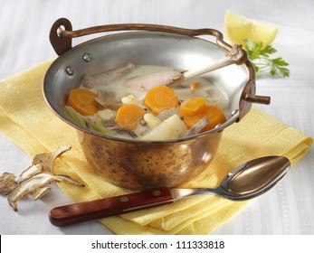 Tarragon Pheasant Soup In Cauldron On White Cloth
