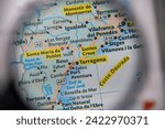 Tarragona,Costa Daurada,Spain,map seen through a magnifying glass,selective focus