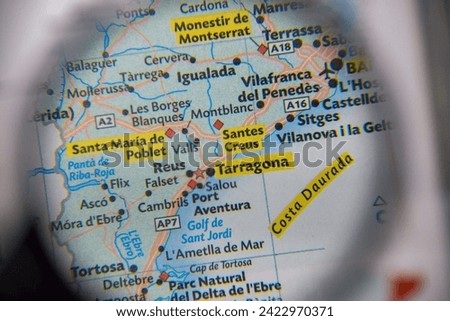 Tarragona,Costa Daurada,Spain,map seen through a magnifying glass,selective focus