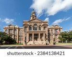 Tarrant County Courthouse in Fort Worth with the Texas flag fluttering in the wind, Texas, USA