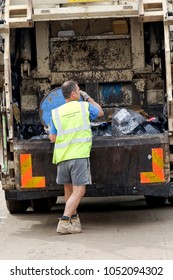 Tarrant Hinton, Dorset, UK - September 1, 2012: A Waste Collector Empties A Bin Into The Back Of A Bin Lorry