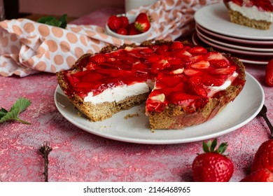 Tart with jelly and strawberries. Delicious tart with fruit and cream.