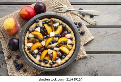 Tart With Peach, Pumpkin, Plum, Pear And Blueberry In Autumn Setting