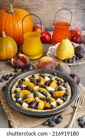 Tart With Peach, Pumpkin, Plum, Pear And Blueberry In Autumn Setting