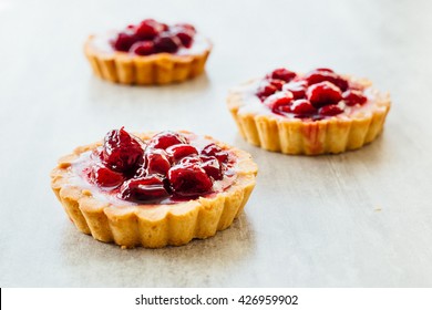 Tart , pie , cake with jellied fresh berries on a grey stone background.  - Powered by Shutterstock