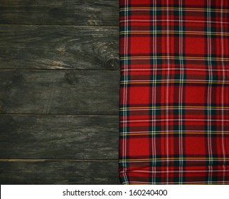 Tartan Textile On Wooden Background