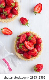 Tartlets With Fresh Strawberry On White Wooden Background, Top View