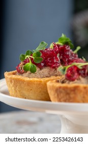 Tartlets stuffed with codfish liver, codfish caviar and microgreens. Traditional cold portioned appetizer in a pastry basket. - Shutterstock ID 2253426143