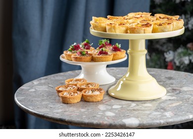 Tartlets stuffed with codfish liver, codfish caviar and microgreens. Traditional cold portioned appetizer in a pastry basket. - Shutterstock ID 2253426147