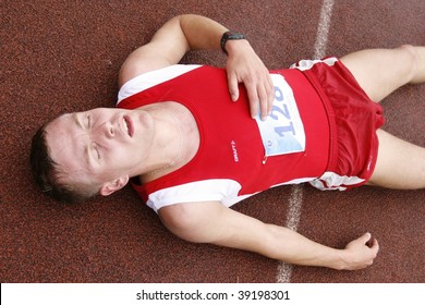 TARTU, ESTONIA - MAY 20: An unidentified sportsman falls down after a race at Student Sell Games organized by Estonian Academic  Sports Federation May 20, 2006 in Tartu, Estonia.