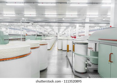 Tashkent, Uzbekistan - February 24, 2018: textile factory. Machinery and equipment in the workshop for the production of thread. 