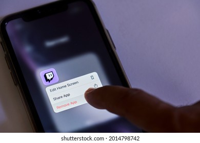 Tashkent, Uzbekistan - July 6, 2021: Uninstalling Twitch application. Deleting popular video streaming service Twitch. Removing Twitch app. Banned, restricted application by the government