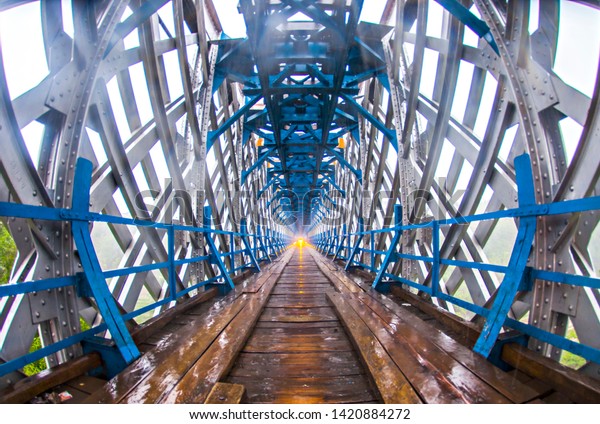 Tasikmalaya,\
West Java, Indonesia: Cirahong Bridge, an old and unique bridge\
that have steel structure and wood. Using by train at the top and\
car and motorcycle in the bridge\
(07/2016).