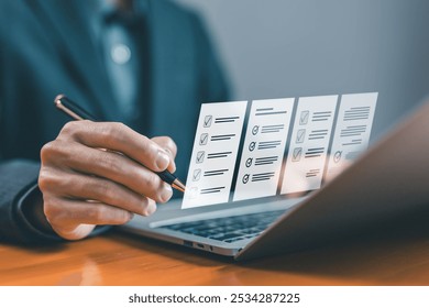 task audit in a list of documents, tick the checkmark in the survey item on a laptop. checklist concept, tick mark evaluation in options check form online, process order, detail business verify task