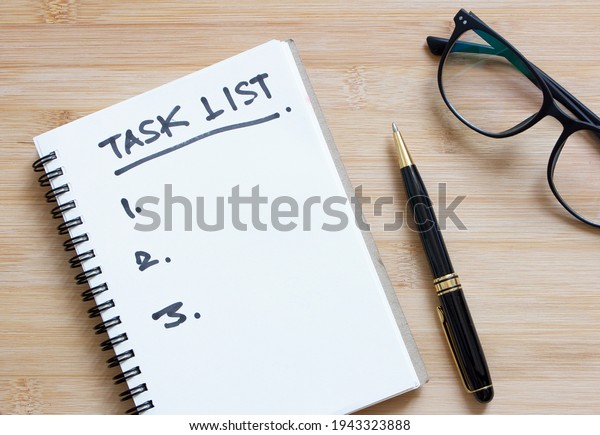 task list or to do list , hand written on\
notebook, deciding to do something\
