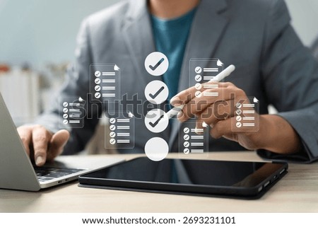 Task management and digital checklist concept. Businessman using stylus on tablet with virtual checklist icon for workflow planning, productivity, approval process, and organized project tracking.
