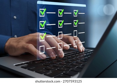 Task management and scheduling software. To-do list for progress tracking. Businessperson using laptop computer to manage and prioritize tasks.