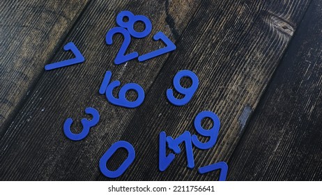 Task In Mathematics. Mathematics Problem For Children. Simple Algebra Examples Using Numbers And Signs From Plastic Numbers On A Wooden Background.