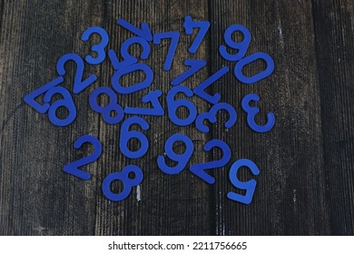 Task In Mathematics. Mathematics Problem For Children. Simple Algebra Examples Using Numbers And Signs From Plastic Numbers On A Wooden Background.